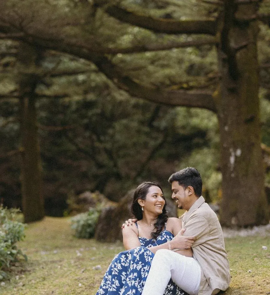 Couple laughing together in a forest in the Himalayas